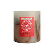 Featuring hand-arranged botanicals enveloping a center display of leafy greens, cinnamon sticks, and vibrant apple slices. The botanical candle is packed with the delightful aroma of Claire Burke's Applejack & Peel® scen